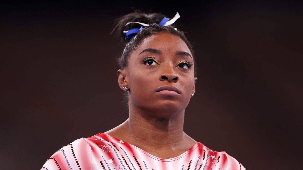 Biles looks on during warm-ups prior to the women's balance beam final.