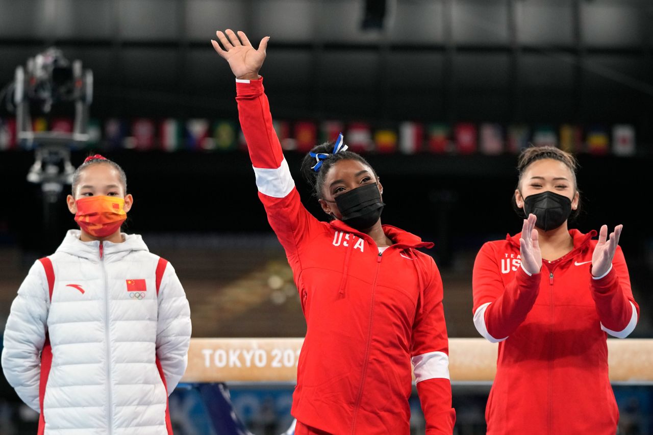 Biles waves to the crowd prior to the event. Biles and Lee got the loudest cheer as the athletes were introduced to the crowd.