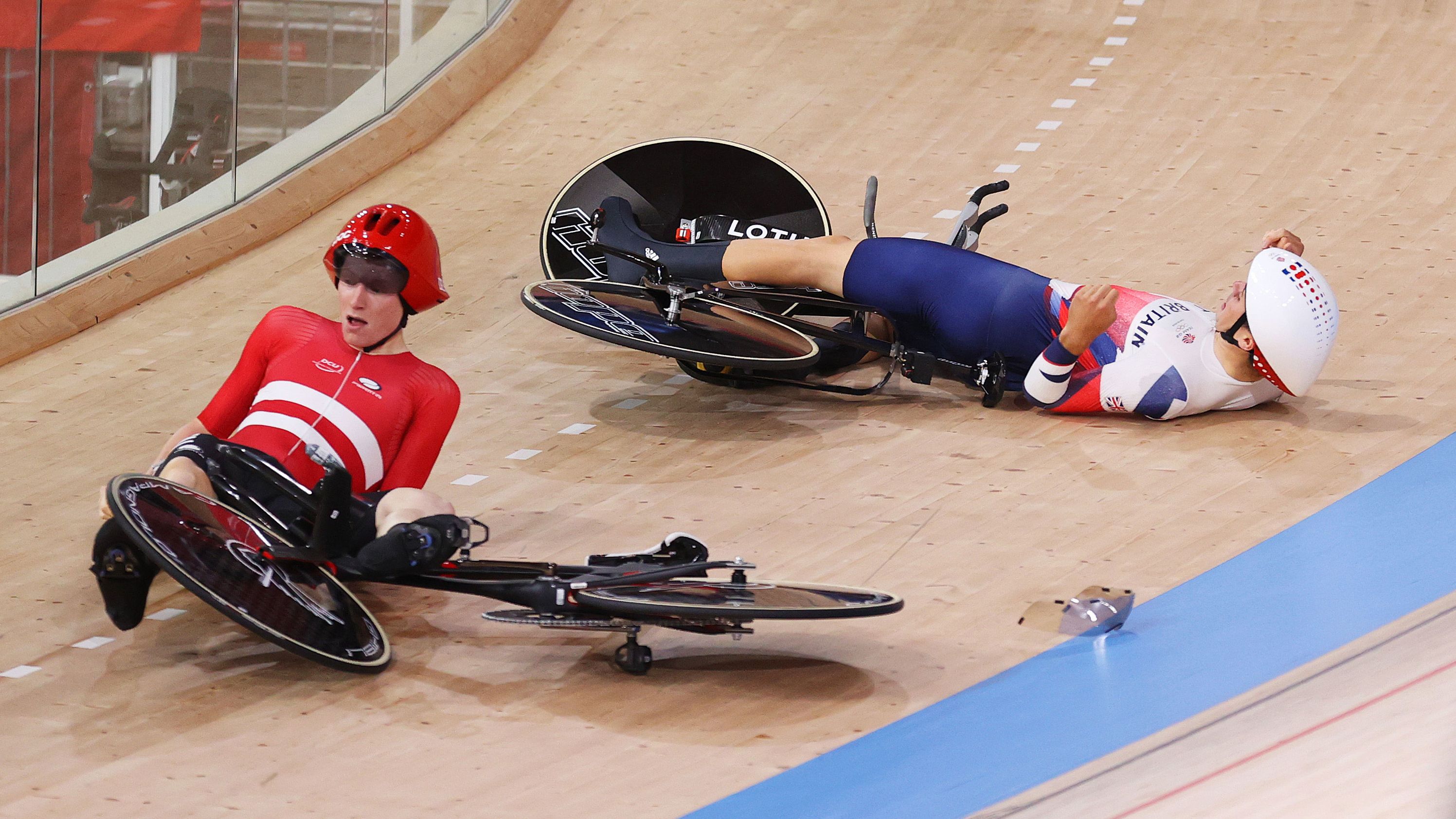 Frederik Madsen of Team Denmark and Charlie Tanfield of Team Great Britain on the ground after the fall.