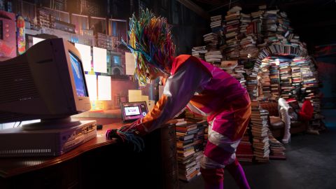 A Meow Wolf character explores the past in the Library, part of Denver's Convergence Station.