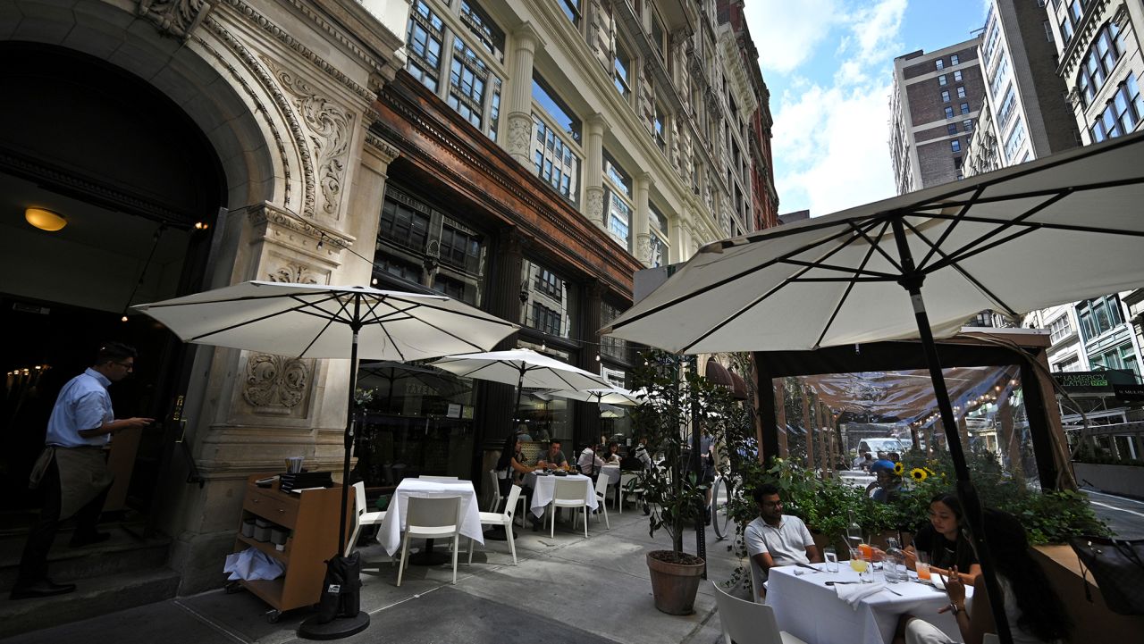 Diners are seated in the outdoor dining area of Gramercy Tavern, where owner Danny Meyer announced a vaccine mandate for all his restaurants, employees and diners will need to show proof of vaccination, New York, NY, July 30, 2021.