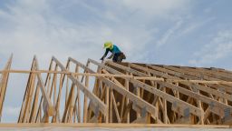 A contractor works on the roof of a house under construction in the Stillpointe subdivision in Sumter, South Carolina, U.S., on Tuesday, July 6, 2021. 