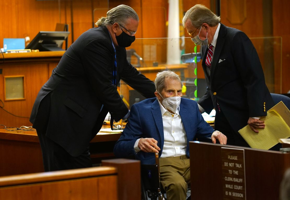 Defense attorneys David Z. Chesnoff, left, and Dick DeGuerin, right, adjust Robert Durst's wheelchair during opening statements in his murder trial on May 18, 2021.