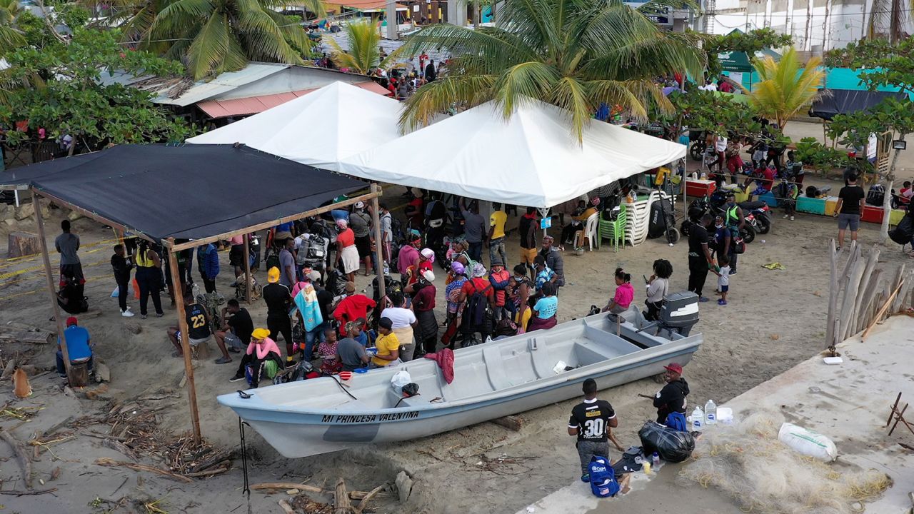 Aerial shot of the ticketing facility at Necocli's pier, where migrants queue before boarding a ferry. 