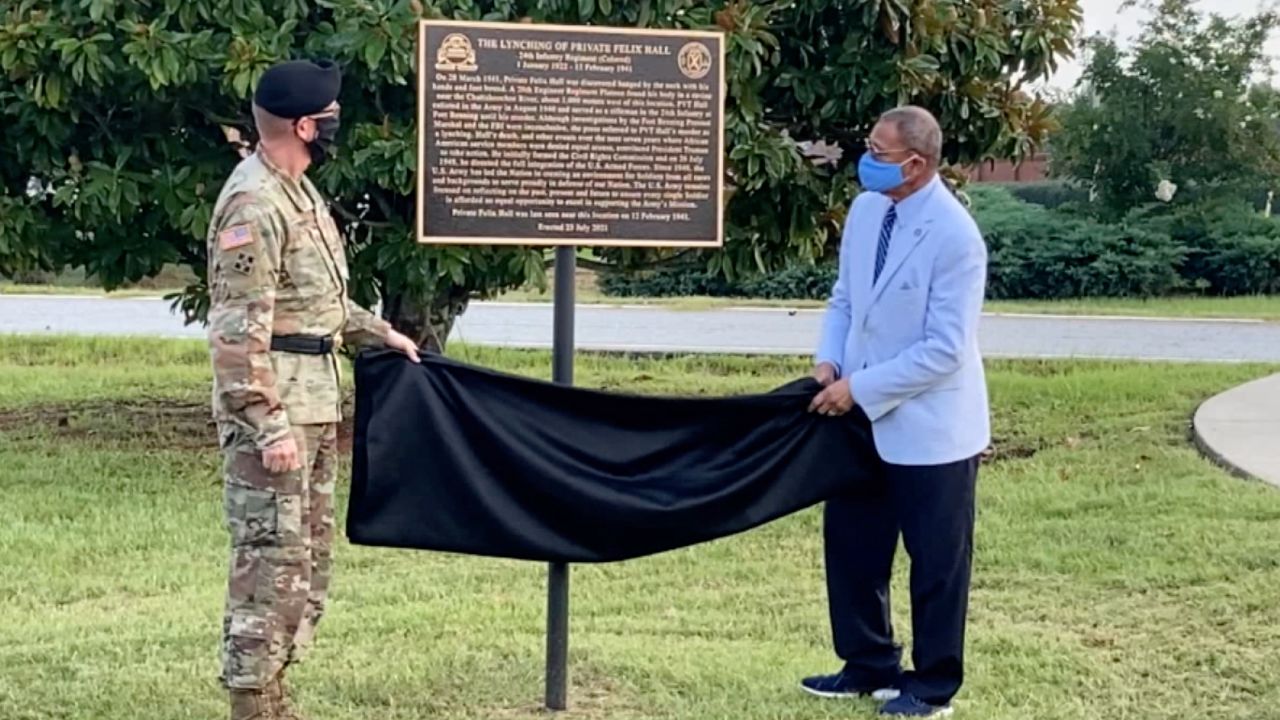 Lt. Gen. Theodore Martin and US Rep. Sanford Bishop unveil the marker honoring Pvt. Felix Hall.