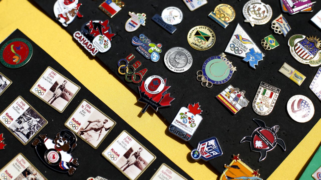 Bud Kling, pin trading centre coordinator in the CIBC Pan Am / Parapan Am Athletes' Village has a table with pins from various Olympics and sporting events in Toronto, July 23, 2015.        (Marta Iwanek/Toronto Star via Getty Images)