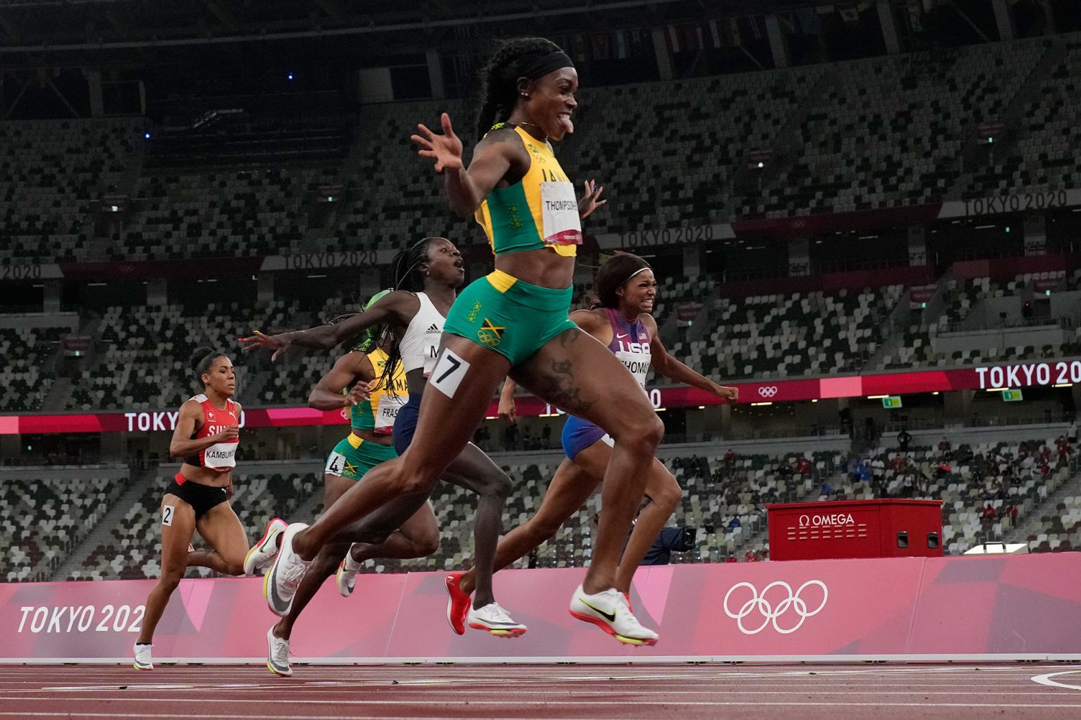 Jamaica's Elaine Thompson-Herah reacts <a href="index.php?page=&url=https%3A%2F%2Fwww.cnn.com%2Fworld%2Flive-news%2Ftokyo-2020-olympics-08-03-21-spt%2Fh_bf3e0de4ba9674243fe29a8b449e5c1b" target="_blank">after defending her crown </a>in the 200 meters on August 3. She also won gold in the 100 meters on Saturday. She's the first-ever woman to win the 100 and 200 double at consecutive Olympic Games.