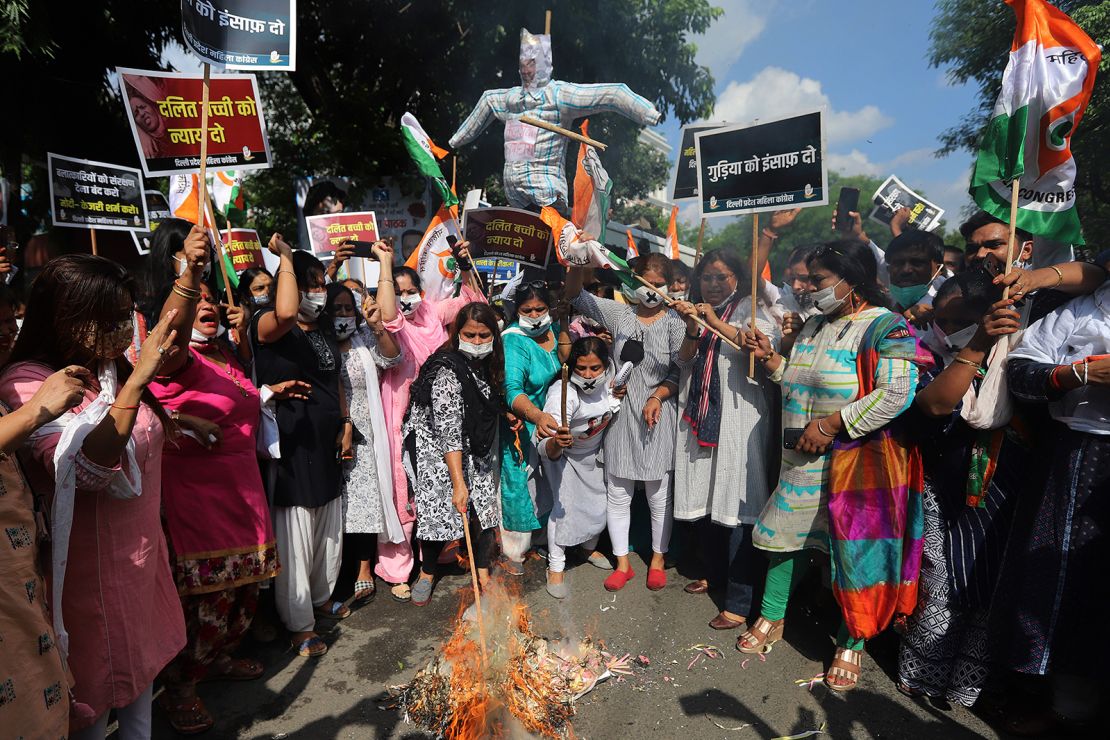 Protesters burn an effigy of Indian Prime Minister Narendra Modi and Delhi Chief Minister Arvind Kejriwal during a demonstration in Delhi on August 3.
