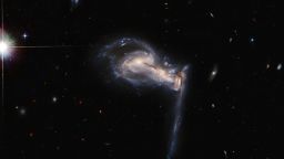 A dramatic triplet of galaxies takes centre stage in this latest Picture of the Week from the NASA/ESA Hubble Space Telescope, which captures a three-way gravitational tug-of-war between interacting galaxies. This system —known as Arp 195— is featured in the Atlas of Peculiar Galaxies, a list which showcases some of the weirder and more wonderful galaxies in the universe. Observing time with the Hubble Space Telescope is extremely valuable, so astronomers don't want to waste a second. The schedule for Hubble observations is calculated using a computer algorithm which allows the spacecraft to occasionally gather bonus snapshots of data between longer observations. This image of the clashing triplet of galaxies in Arp 195 is one such snapshot. Extra observations such as these do more than provide spectacular images — they also help to identify promising targets to follow up with telescopes such as the upcoming NASA/ESA/CSA James Webb Space Telescope.