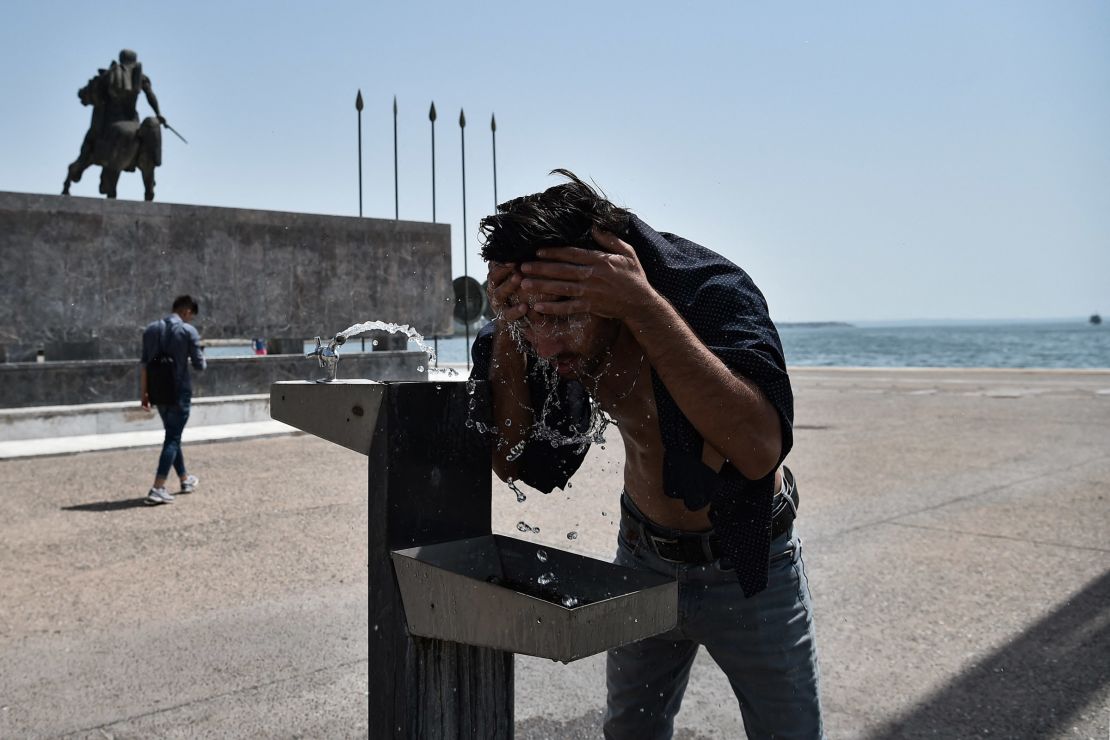 A man cools off with water during a heatwave in Thessaloniki, Greece, on July 29.