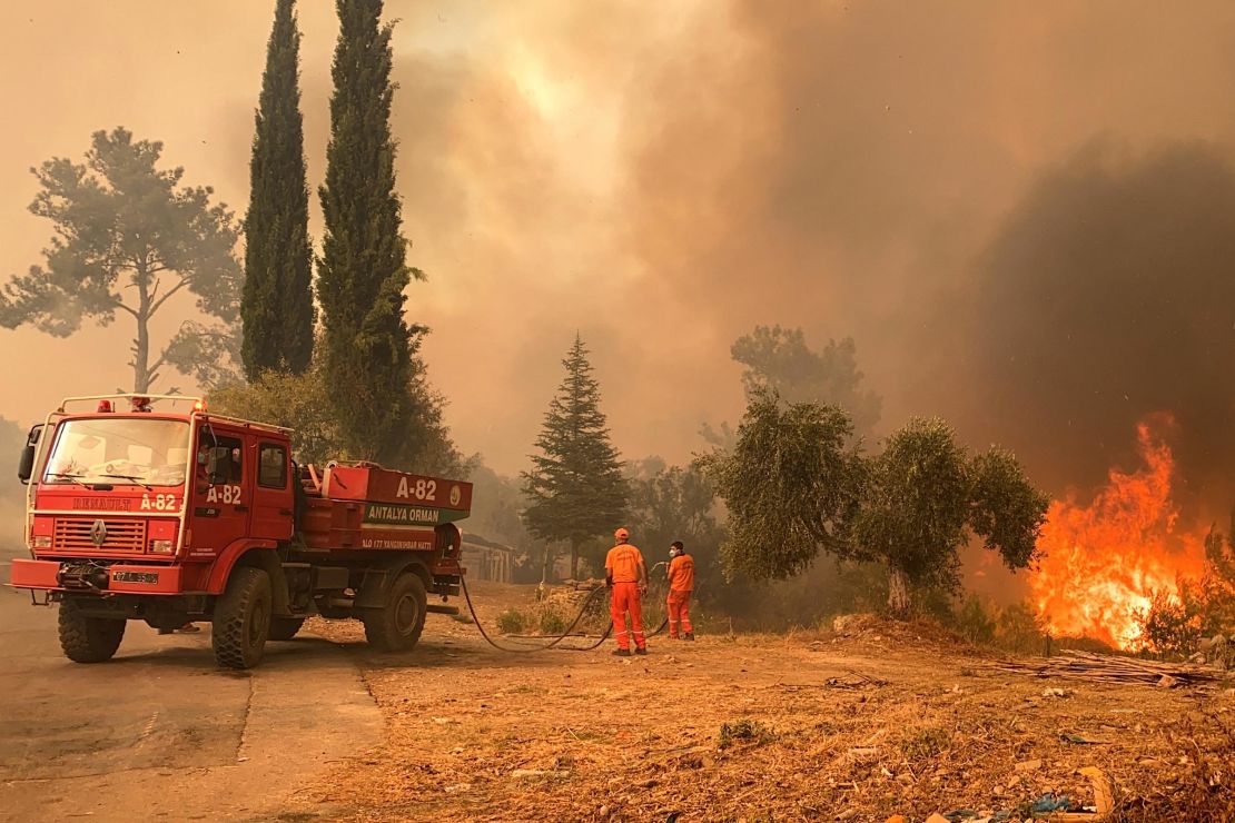A firefighter battles with fire during a massive wildfire which engulfed a Mediterranean resort region on Turkey's southern coast near the town of Manavgat, on July 29.
