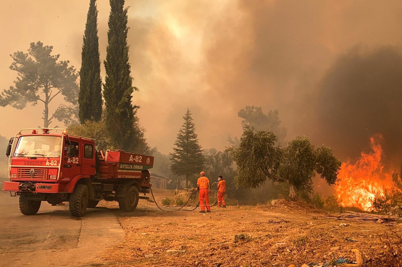 Firefighters battle a massive wildfire that engulfed a Mediterranean resort region on Turkey's southern coast near the town of Manavgat on July 29.