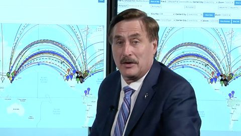 Mike LIndell appearing in a scene from his video, "Absolute Proof."
