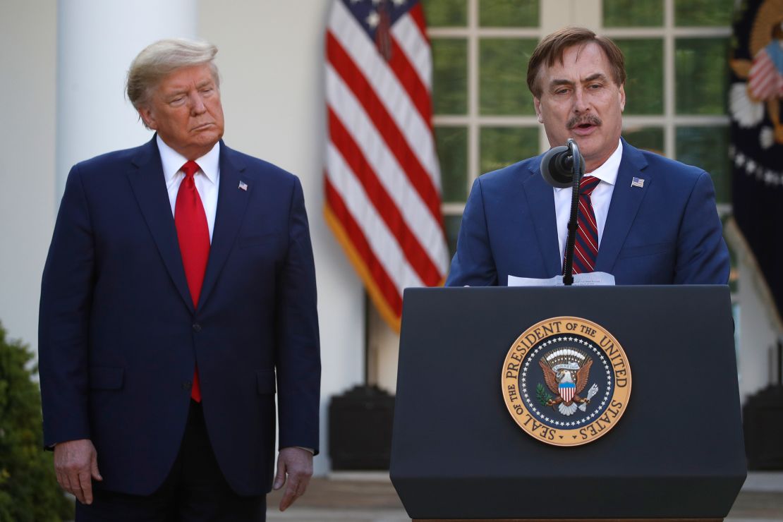 My Pillow CEO Mike Lindell speaks as President Donald Trump listens during a briefing in the Rose Garden of the White House on March 30, 2020.