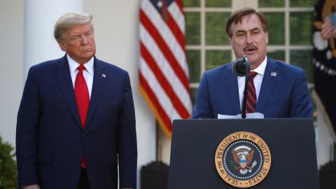 My Pillow CEO Mike Lindell speaks as President Donald Trump listens during a briefing in the Rose Garden of the White House on March 30, 2020.