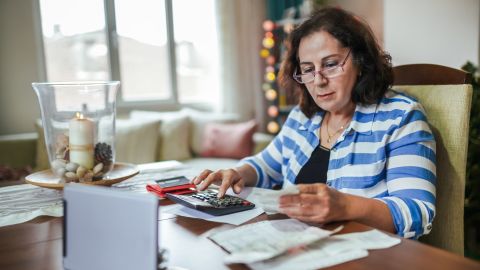 A retired woman budgets on a low income.