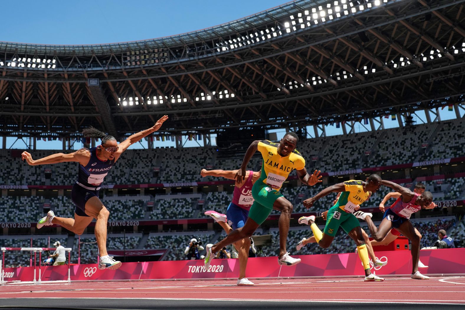 Jamaica's Hansle Parchment, third from left, <a href="index.php?page=&url=https%3A%2F%2Fwww.cnn.com%2Fworld%2Flive-news%2Ftokyo-2020-olympics-08-04-21-spt%2Fh_fc93790d8fbfbb7e24eb0e1c79d16530" target="_blank">wins the 110-meter hurdles</a> on August 5. He finished with a time of 13.04 seconds, just beating out the United States' Grant Holloway, who ran a 13.09.