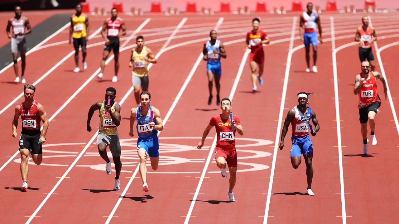 Athletes compete in round one of the men's 4x100m relay heats.
