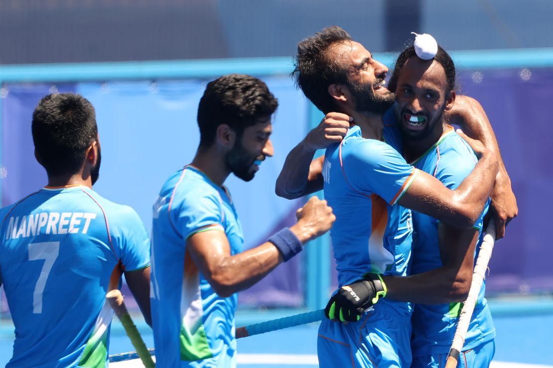 Harmanpreet Singh celebrates scoring their third goal with teammates during the men's bronze medal match. 