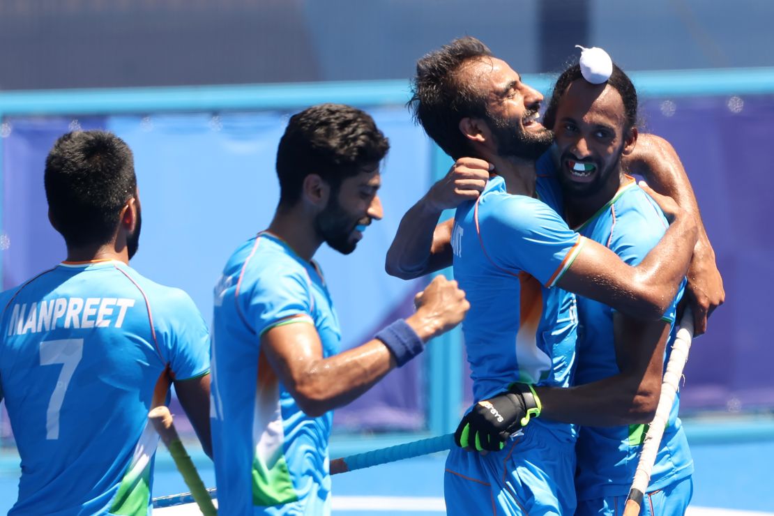 Harmanpreet Singh celebrates scoring their third goal with teammates during the men's bronze medal match.