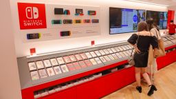 Visitors look at Super Mario themed products inside Nintendo Store in Parco Shopping Mall in Tokyo, on August 2, 2021. 