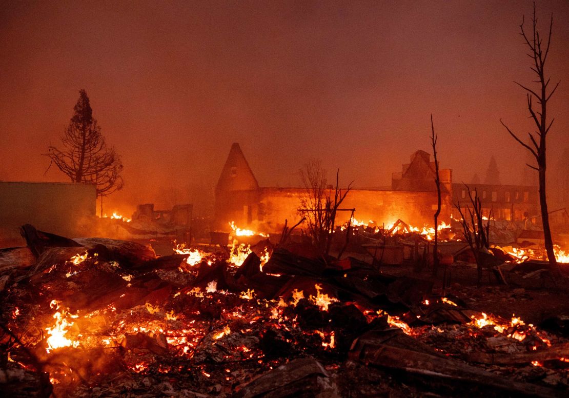 Buildings burn as the Dixie fire tears through downtown Greenville, California.