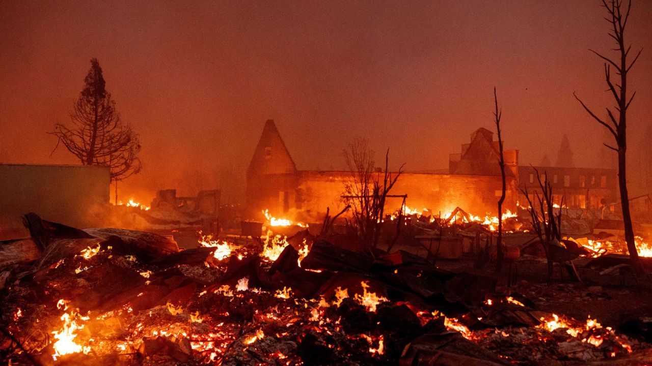 Buildings burn as the Dixie fire tears through downtown Greenville, California.