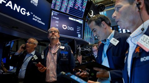 Traders work during the IPO for Chinese ride-hailing company Didi Global on the New York Stock Exchange.