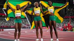 Elaine Thompson-Herah, center, of Jamaica, celebrates after winning the women's 100-meter final with Shelly-Ann Fraser-Pryce, of Jamaica, second place, and Shericka Jackson, of Jamaica, third, at the 2020 Summer Olympics, Saturday, July 31, 2021, in Tokyo. (AP Photo/Petr David Josek)