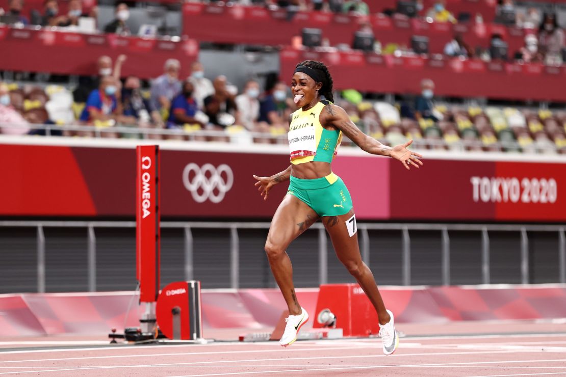 Thompson-Herah celebrates winning the gold medal in the women's 200m final on August 03 in Tokyo. 