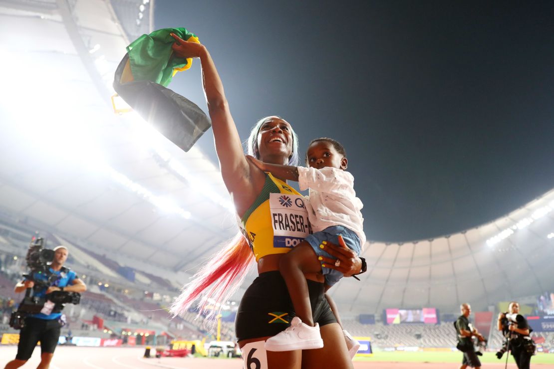 Shelly-Ann Fraser-Pryce of Jamaica celebrates her incredible comeback to the track with her son Zyon, after winning the women's 100m final at the 2019 World Athletics Championships in Doha.