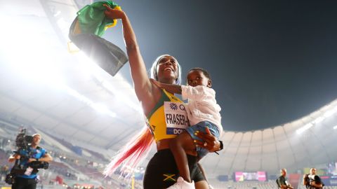 Shelly-Ann Fraser-Pryce of Jamaica celebrates her incredible comeback to the track with her son Zyon, after winning the women's 100m final at the 2019 World Athletics Championships in Doha.