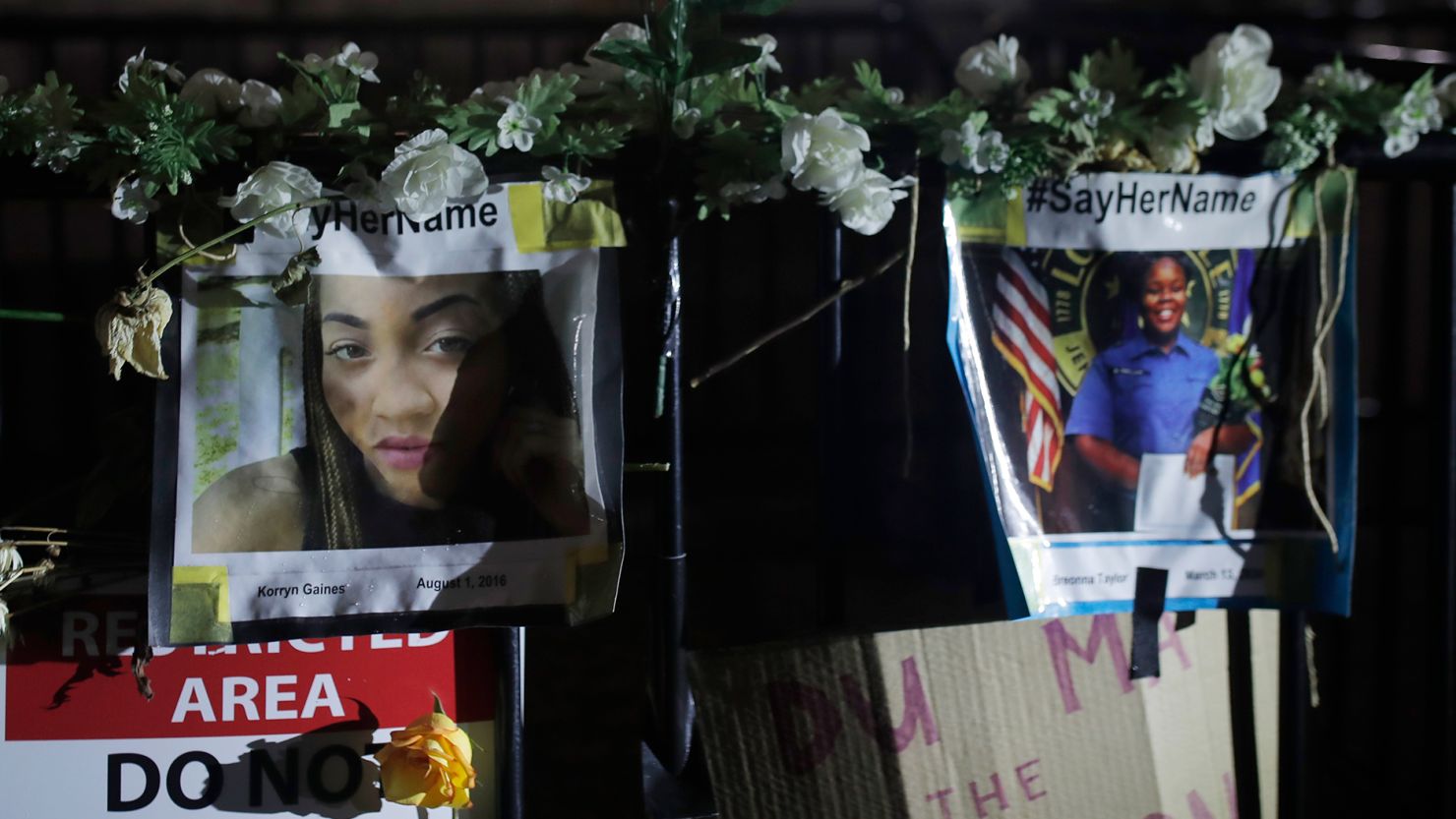 A picture of Korryn Gaines, left, is next to a photo of Breonna Taylor in a display in front of the White House on June 19, 2020, as people gathered to mark Juneteenth.