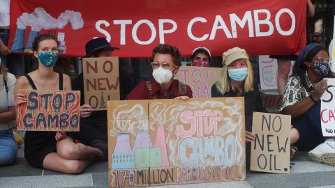 Cambo oilfield protestors rally outside a UK government building in Edinburgh, Scotland on July 19, 2021. 