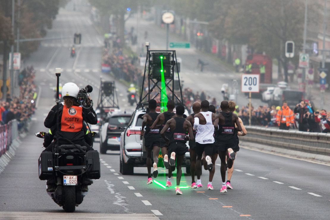 Kipchoge, in the white vest, is accompanied by pacemakers as he attempts to break the two-hour barrier for a marathon.  