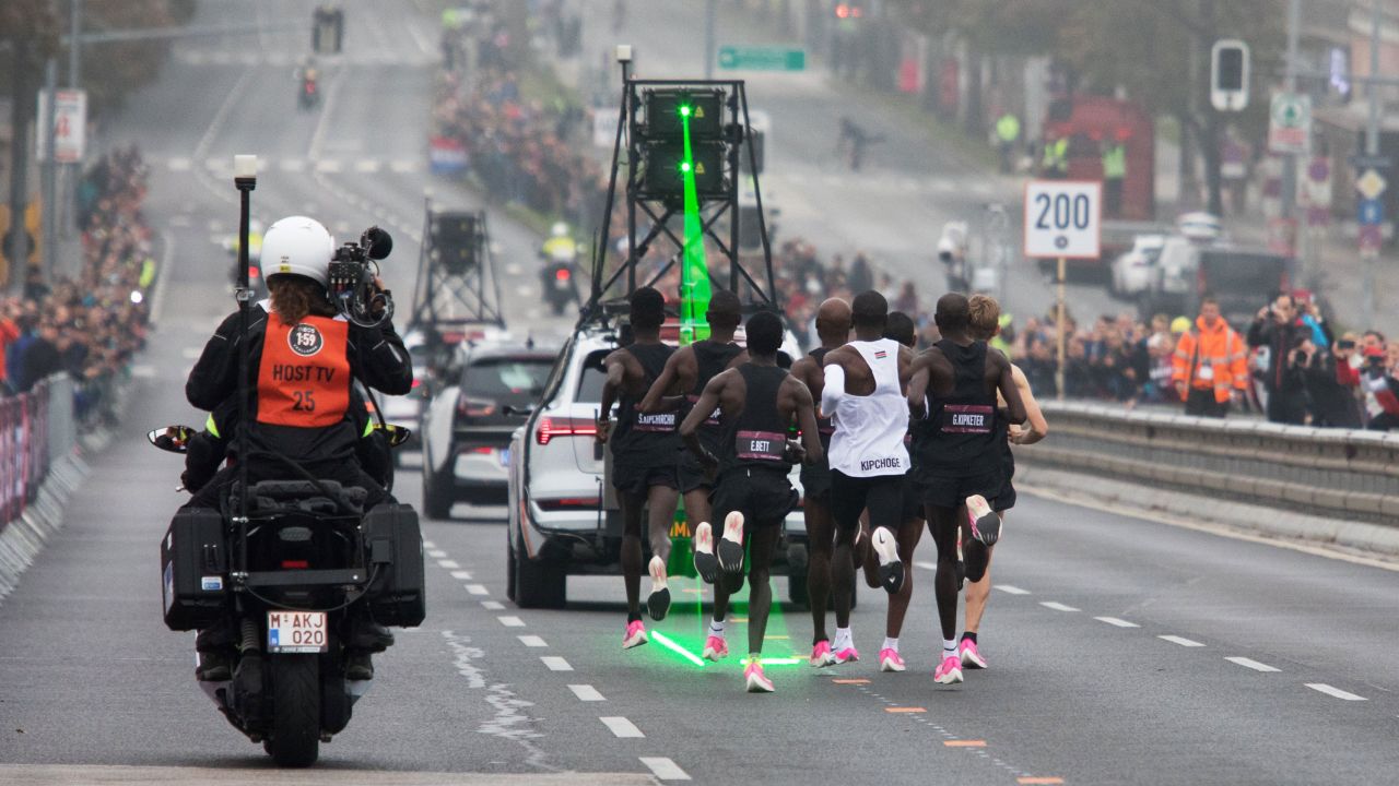 Kipchoge, in the white vest, is accompanied by pacemakers as he attempts to break the two-hour barrier for a marathon.