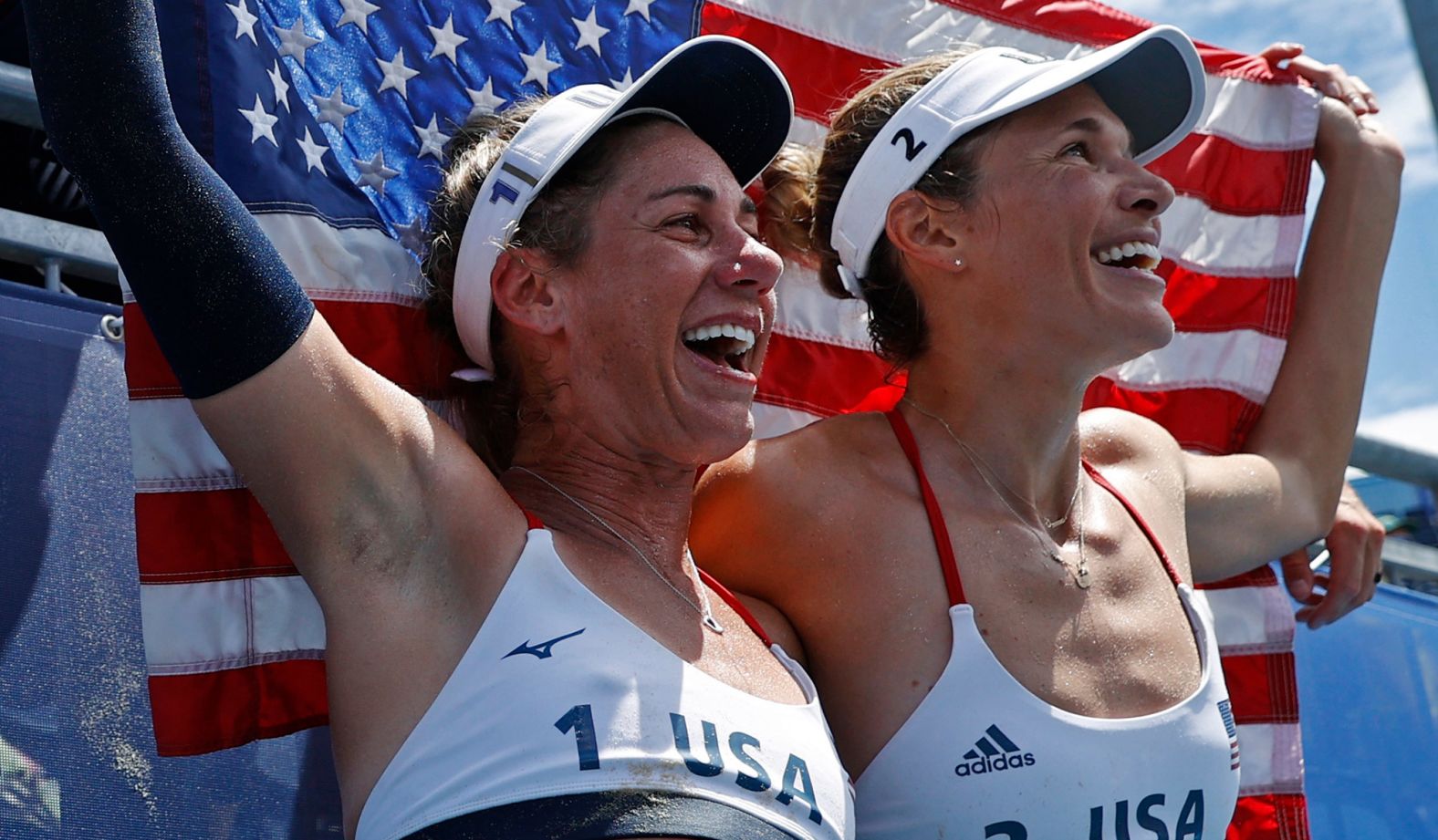From left, American beach volleyball players April Ross and Alix Klineman celebrate after they won their <a href="index.php?page=&url=https%3A%2F%2Fwww.cnn.com%2Fworld%2Flive-news%2Ftokyo-2020-olympics-08-05-21-spt%2Fh_faefc6150a210d35f46498be8df1f679" target="_blank">gold-medal match</a> on August 6.