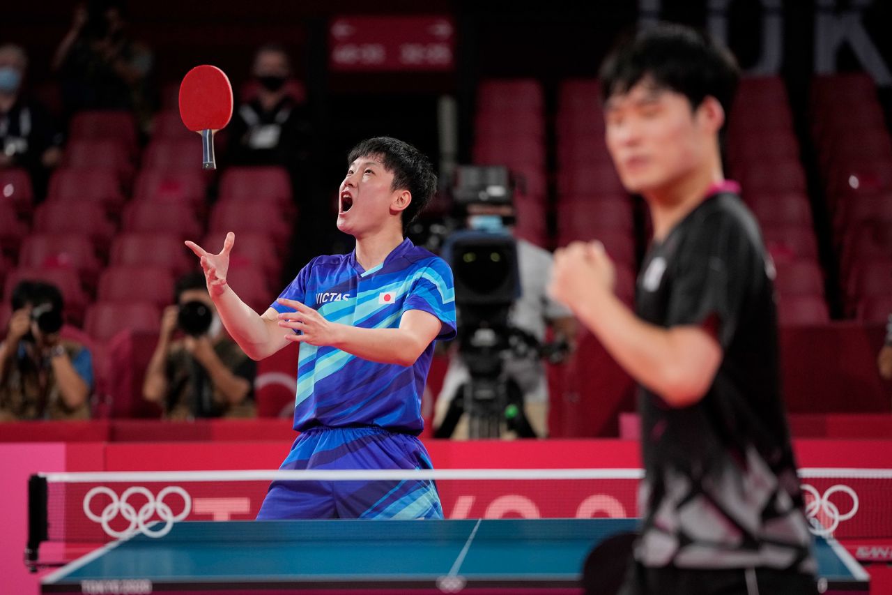 Japan's Tomokazu Harimoto, left, celebrates after defeating South Korea's Jang Woo-jin to win a bronze medal in table tennis on August 6.
