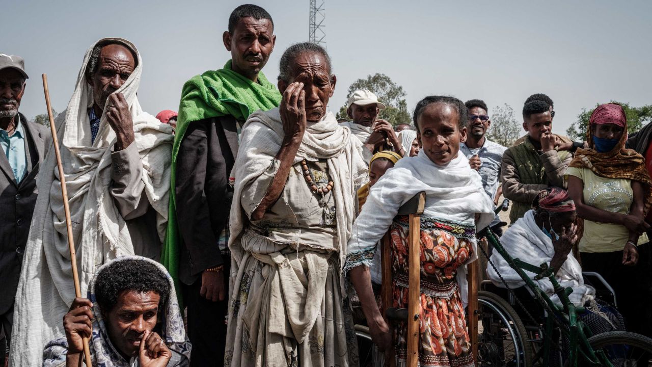 People wait to receive food aid from a local NGO in Tigray's capital Mekele in June.