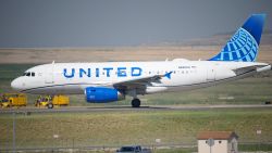 In this July 2, 2021 file photo, a United Airlines jetliner taxis down a runway for take off from Denver International Airport in Denver.  United Airlines will require U.S.-based employees to be vaccinated against COVID-19 by late October, and maybe sooner. United announced the decision Friday, Aug. 6.