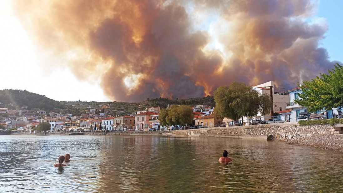 Smoke and flames rise over the village of Limni on the Greek island of Evia.
