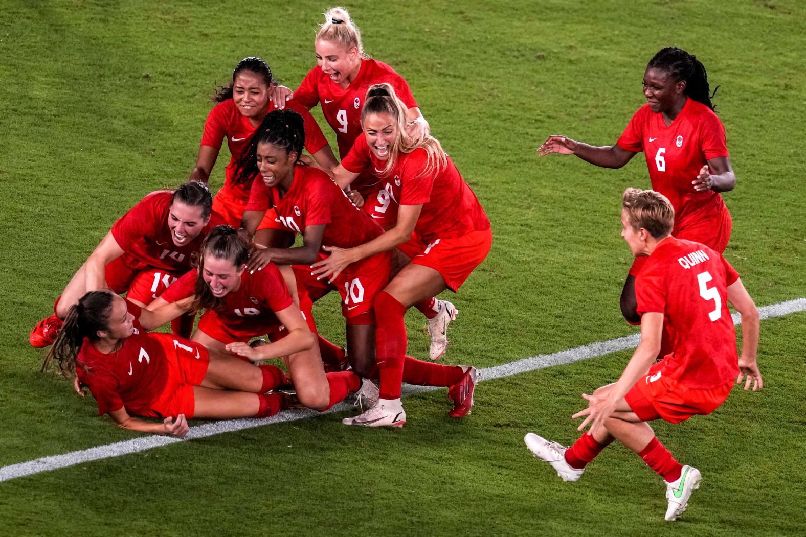 Teammates mob Canada's Julia Grosso after she scored the winning penalty in the shootout against Sweden on August 6. The gold-medal match was tied 1-1 after extra time, so a shootout had to decide the winner. It is <a href="https://www.cnn.com/world/live-news/tokyo-2020-olympics-08-06-21-spt/h_0a52c11c018e696baded3777427d393a" target="_blank">Canada's first gold medal in women's football.</a>