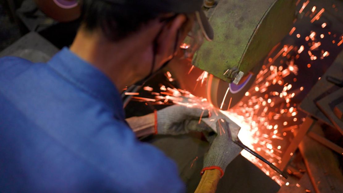 Sparks fly in Maestro Wu's workspace.