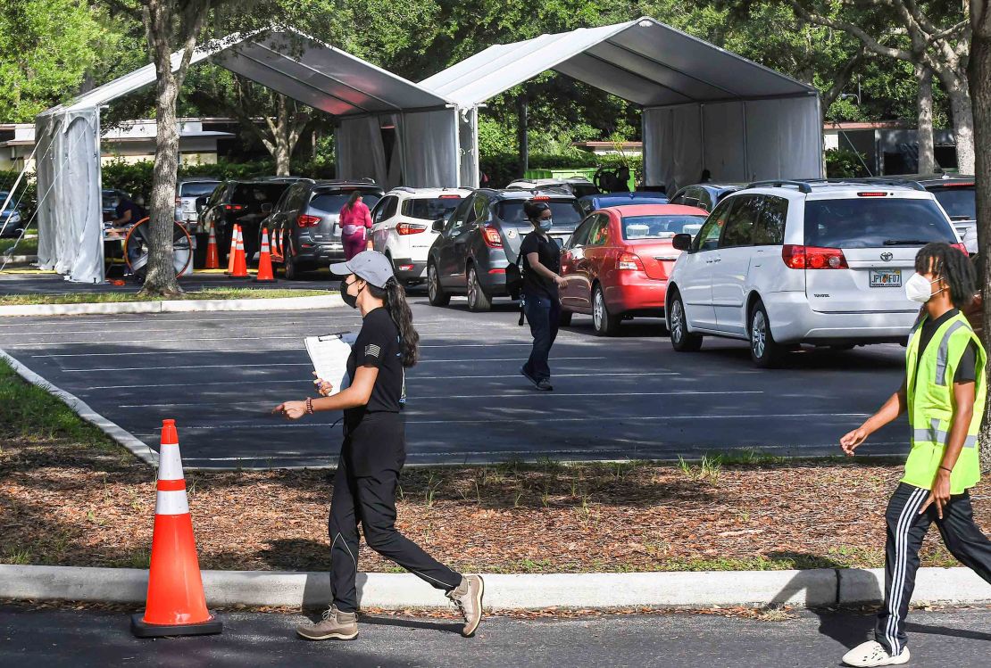 Cars line up at a drive-thru Covid-19 testing site at Econ Soccer Complex in Orlando on August 4, 2021.