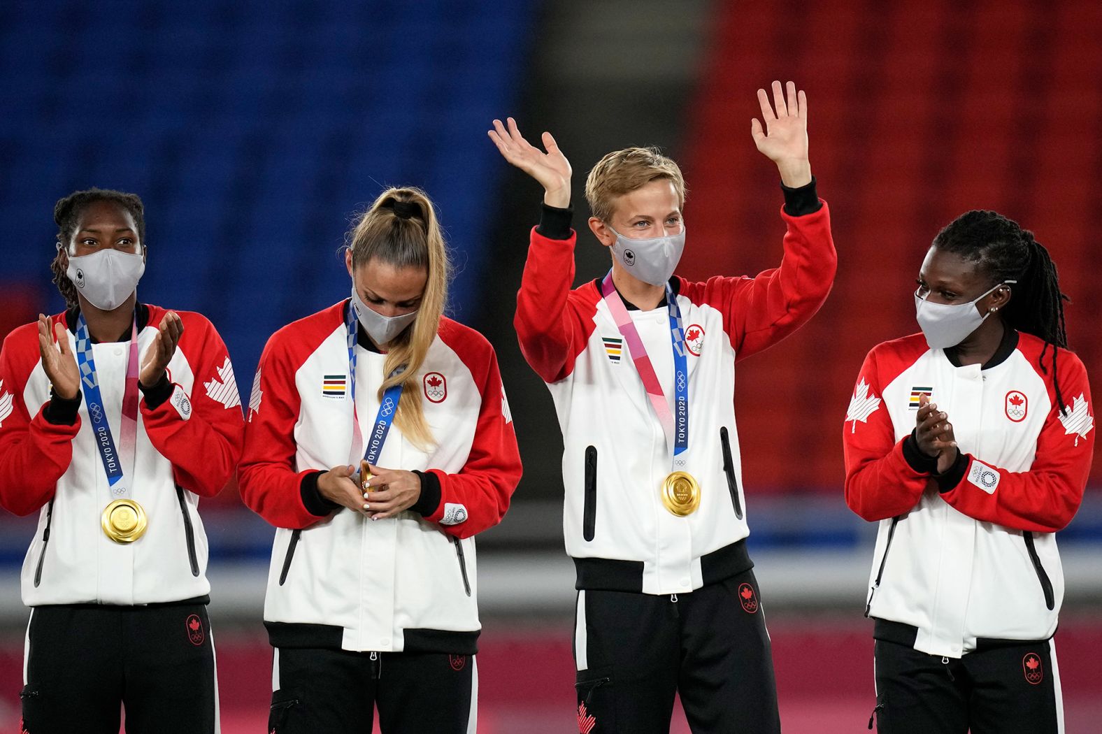 Canadian footballer Quinn waves during a medal ceremony in Yokohama, Japan. Quinn, who goes by just the one name, is <a href="index.php?page=&url=https%3A%2F%2Fwww.cnn.com%2F2021%2F08%2F05%2Fsport%2Fquinn-canada-sweden-spt-intl%2Findex.html" target="_blank">the first trans and the first nonbinary athlete to win a Olympic medal.</a>