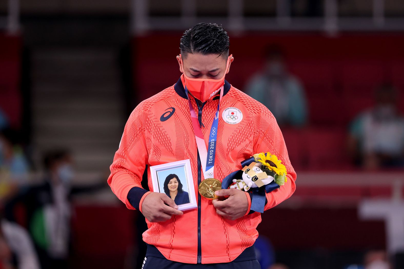 Japan's Ryo Kiyuna holds a photo of his late mother after <a href="index.php?page=&url=https%3A%2F%2Fwww.cnn.com%2Fworld%2Flive-news%2Ftokyo-2020-olympics-08-06-21-spt%2Fh_847fb05b498eda3551989c461857a2e8" target="_blank">winning gold in karate's kata event</a> on August 6. Kiyuna is from the island of Okinawa, which is considered the birthplace of karate.
