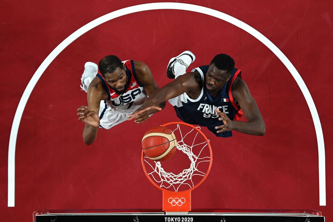Durant and France's Moustapha Fall go for a rebound.