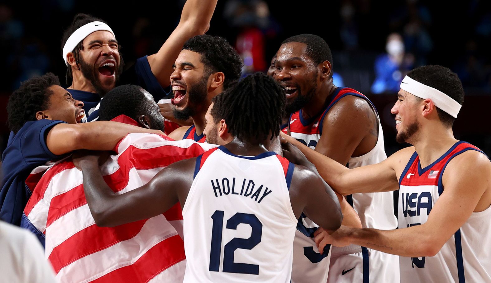 US basketball players celebrate after <a href="index.php?page=&url=https%3A%2F%2Fwww.cnn.com%2Fworld%2Flive-news%2Ftokyo-2020-olympics-08-07-21-spt%2Fh_fbb5e6e6f9790e71f12c0994183a4819" target="_blank">defeating France 87-82 in the gold-medal game</a> on August 7. It's the Americans' fourth straight gold in men's basketball.