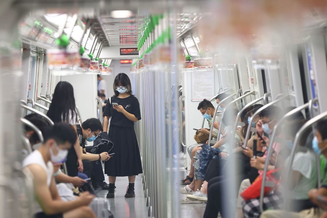 People wear face masks on the subway amid the Delta variant outbreak on July 27 in Nanjing, Jiangsu Province of China. 