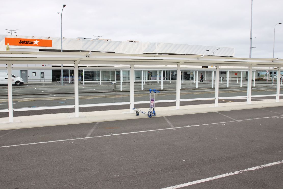 An abandoned luggage trolley in front of the Jetstar terminal at Auckland Airport domestic terminal on October 7, 2020, two days before the lifting of restrictions for the Auckland region that were put in place following the re-emergence of Covid-19 in the community.